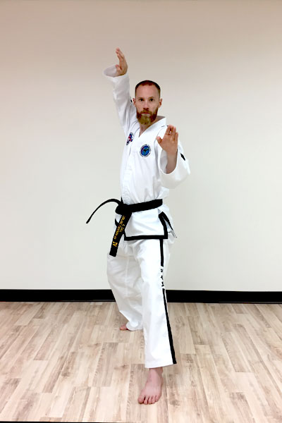 A taekwon-do twin knife-hand block.
