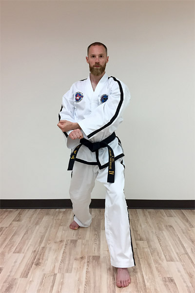 The preparation for a forearm rising block in taekwon-do